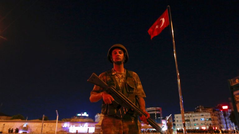A Turkish soldier stands guard near Taksim Square in Istanbul
