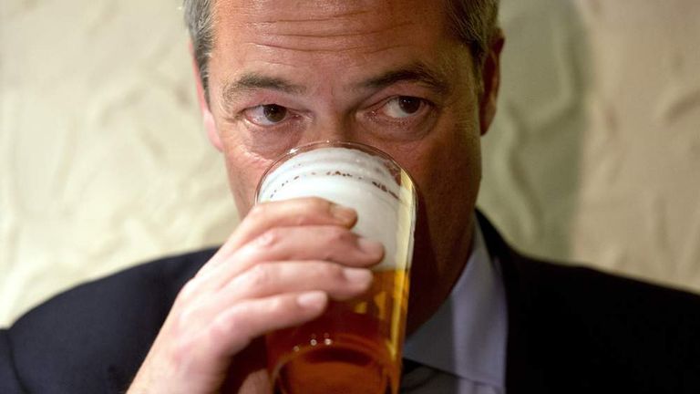 UKIP leader Nigel Farage drinks a pint of beer.