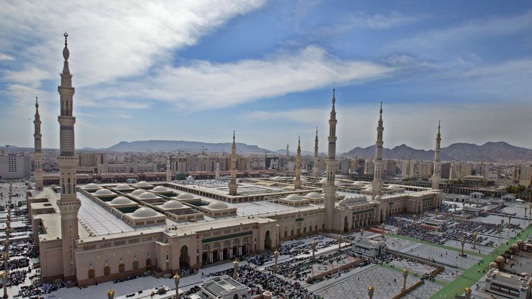 Muslim pilgrims pray near the Prophet Muhammad mosque, Medina, Saudi Arabia