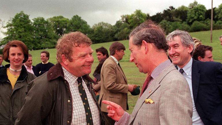 The Prince of Wales sharing a joke with actor Geoffrey Hughes, who has died aged 68.