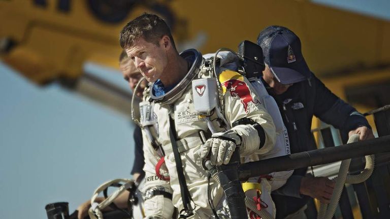FILE - This photo provided by Red Bull Stratos shows pilot Felix Baumgartner of Austria reacting after his mission was aborted in Roswell, N.M., on Oct. 9, 2012.