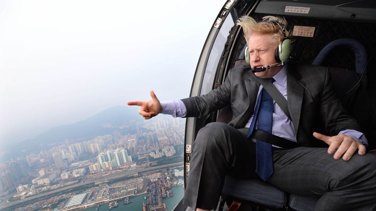 Here, Mr Johnson is pictured on a helicopter in Hong Kong in 2013, but his flight to Brussels was not quite as enjoyable