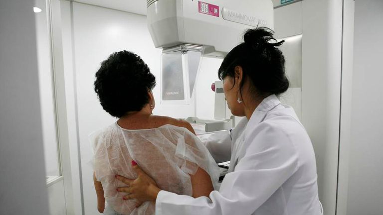 A woman undergoes a free mammogram.