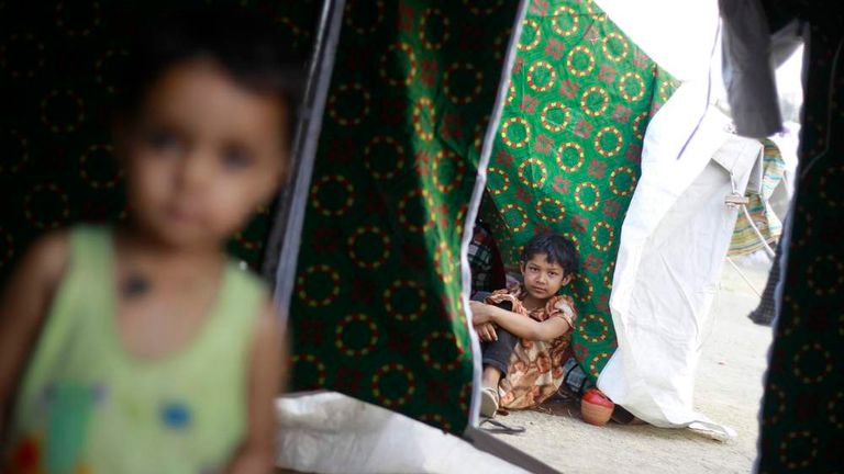 Children sit in tents amid riots in Meiktila