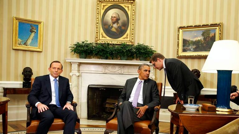 White House Press Secretary Carney whispers to U.S. President Obama ...