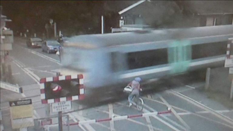 Level Crossing Near-Miss: Cyclist Cheats Death | UK News | Sky News