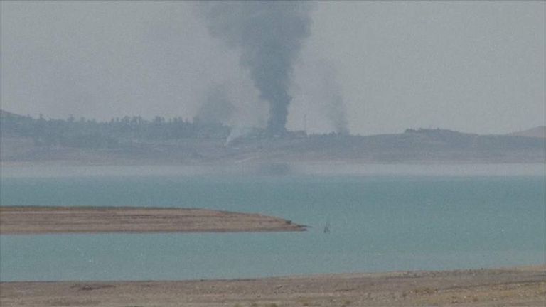 Smoke rises from an area close to Iraq's Mosul dam
