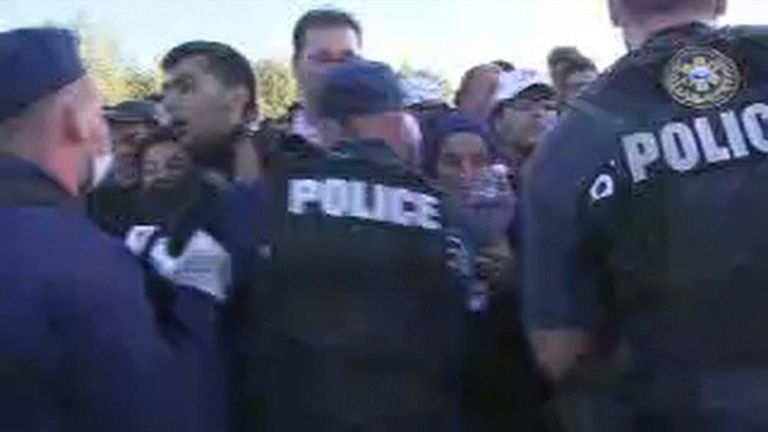 Refugees scuffle with police on the Hungary/Serbia border.