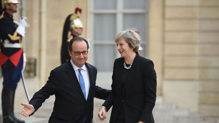 French President Francois Hollande welcomes Prime Minister Theresa May to the Elysee Palace in Paris on her first foreign trip since taking office