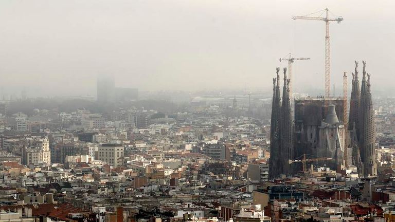 The Basilica Sagrada Familia is seen as fog gradually recedes in Barcelona