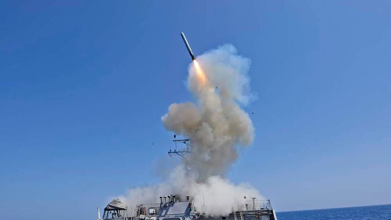 US Navy guided-missile destroyer USS Barry launching a Tomahawk cruise missile