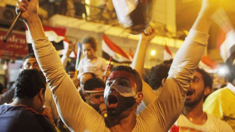 Anti-Mursi protesters chant as they celebrate near Tahrir square after the announcement of the removal from office of Egypt's deposed President Mohamed Mursi