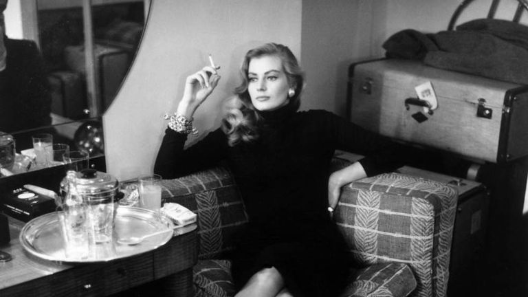 Swedish actress Anita Ekberg relaxes with a cigarette in London in 1955