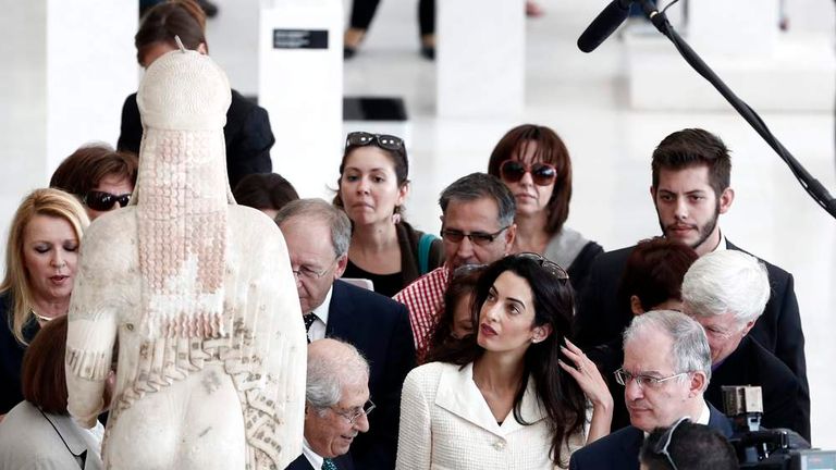 Human rights lawyer Amal Alamuddin Clooney observes a Kore statue during a visit at the Acropolis museum in Athens