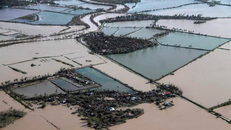 Flooded fields and wrecked villages in Iloilo Province
