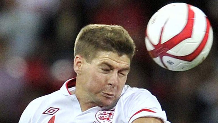 Steven Gerrard heads a ball for England