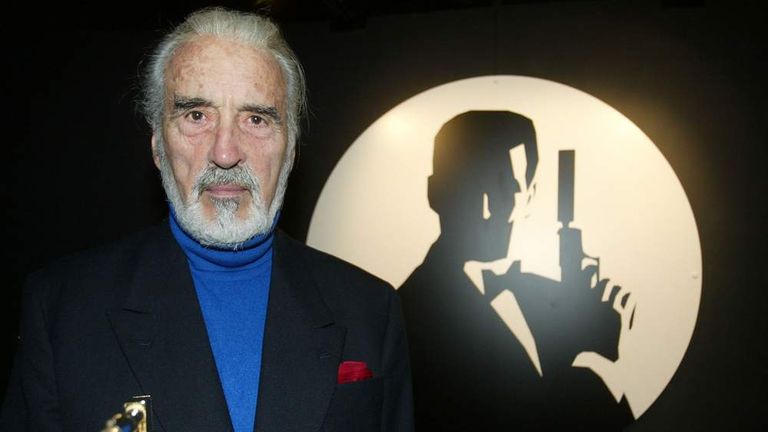 BRITISH ACTOR CHRISTOPHER LEE POSES WITH THE ORIGINAL GOLDEN GUN FROMTHE BOND FILM IN LONDON.