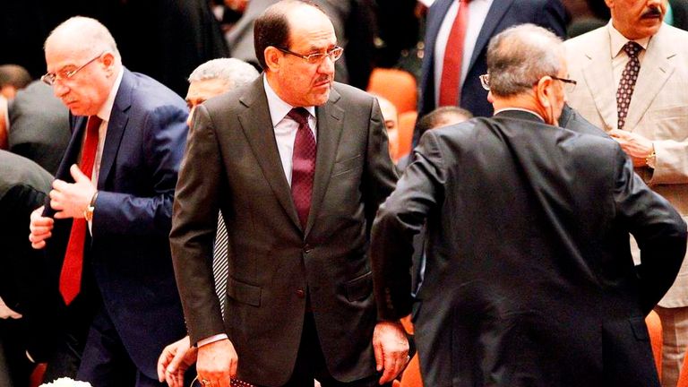 Iraqi PM Nuri al-Maliki (c) with colleagues in parliament