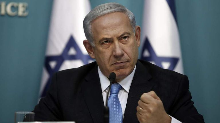 Israeli Prime Minister Benjamin Netanyahu gestures as he delivers a speech