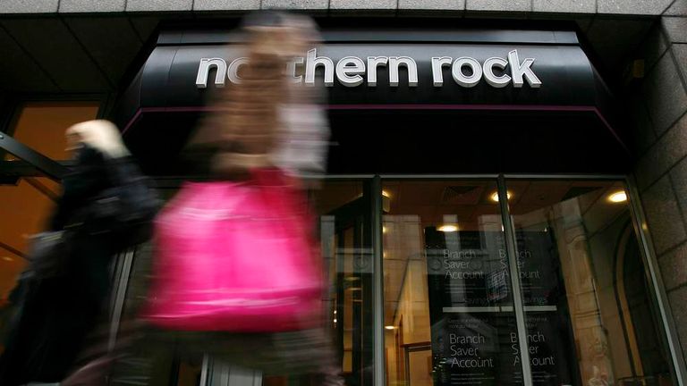 Pedestrians walk past a branch of the Northern Rock bank in the City of London