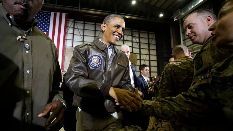 Obama shakes hands with troops after delivering remarks at Bagram Air Base in Kabul