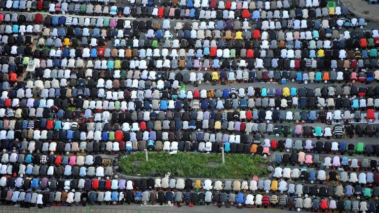 Russia's muslims pray on the first day of Eid al-Fitr at a square in Saint-Petersburg