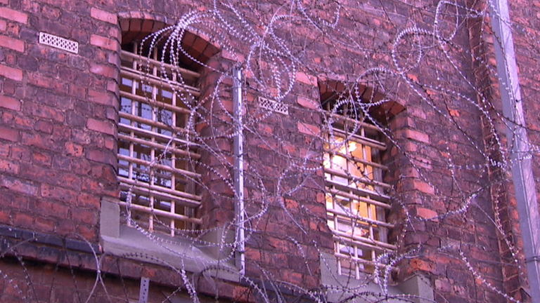 Barbed wire over prison windows