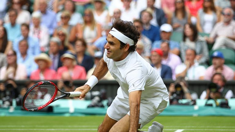  Roger Federer of Switzerland slips during his match against Milos Raonic 