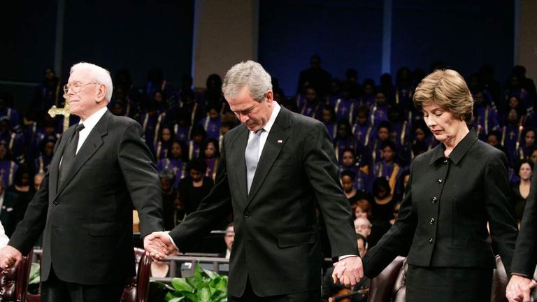 Rev Schuller prays alongside President George W Bush prays while attending memorial for Coretta Scott King in Georgia