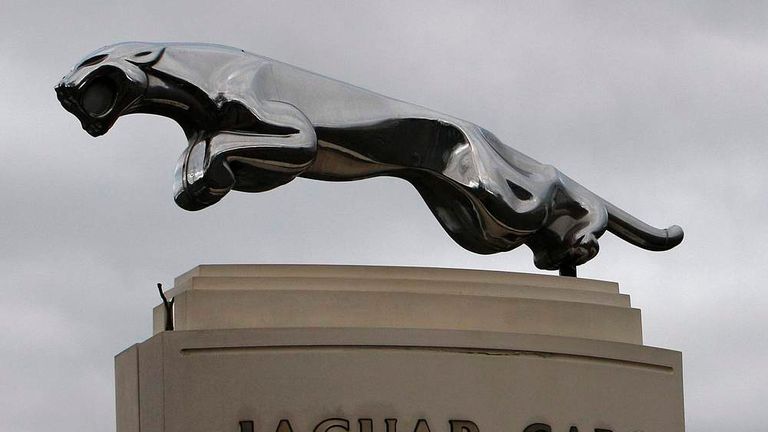 The Jaguar emblem is seen at the gates of its Castle Bromwich plant in Birmingham