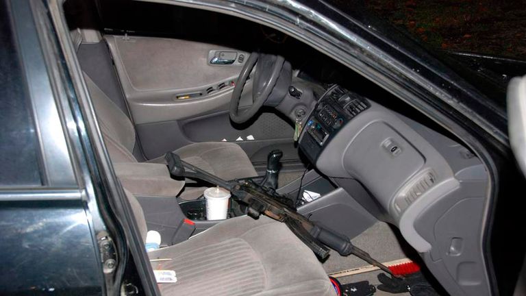 Handout photo of semi-automatic assault rifle inside an abandoned 1998 Honda Accord vehicle belonging to Oscar Ortega-Hernandez