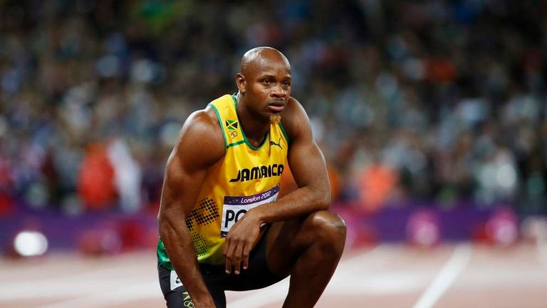 Jamaica's Asafa Powell looks at the scoreboard after running in the men's 100m final during the London 2012 Olympic Games at the Olympic Stadium