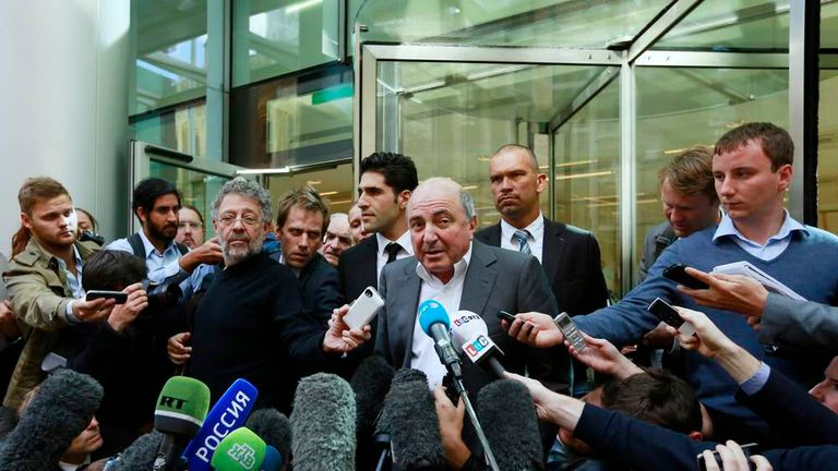 Russian oligarch Boris Berezovsky speaks to members of the media after losing his court battle against Roman Abramovich, at a division of the High Court in London