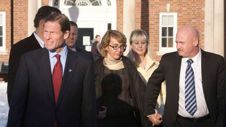 U.S. Senator Blumenthal, former U.S. Representative Giffords and her husband, former astronaut Kelly, leave the Newtown Municipal Building in Newtown,