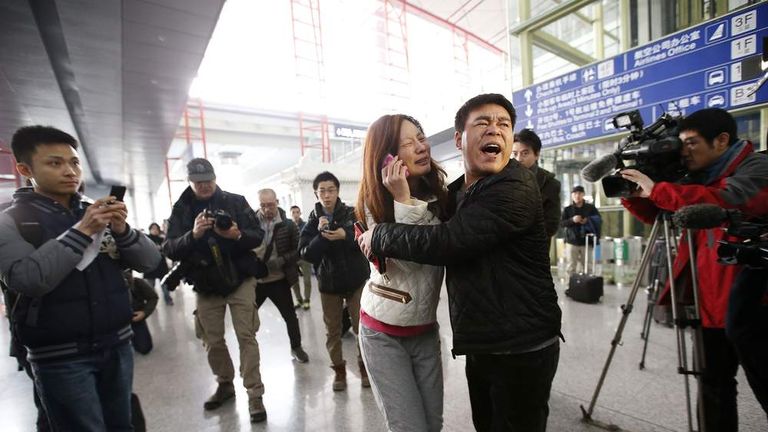 A relative of a passenger onboard Malaysia Airlines flight MH370 cries at the Beijing Capital International Airport