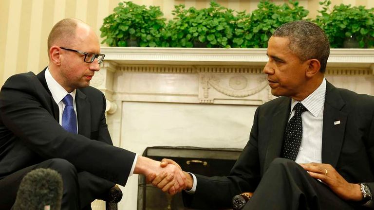 U.S. President Barack Obama shakes hands as he hosts a meeting with Ukraine Prime Minister Arseniy Yatsenyuk in the Oval Office of the White House in Washington