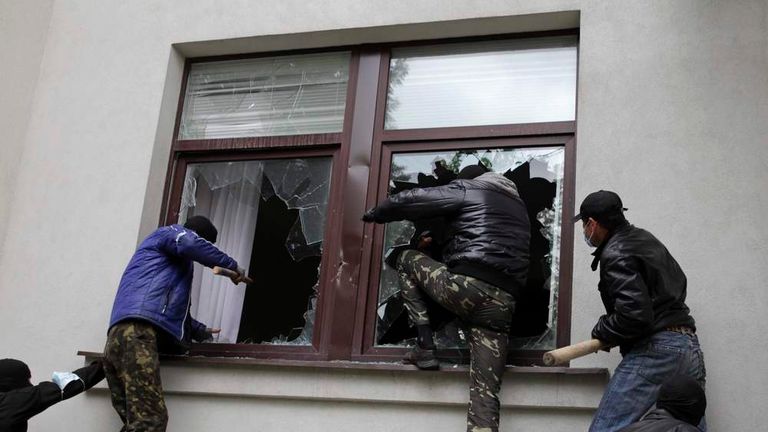 Pro-Russian activists storm the regional government headquarters in Luhansk