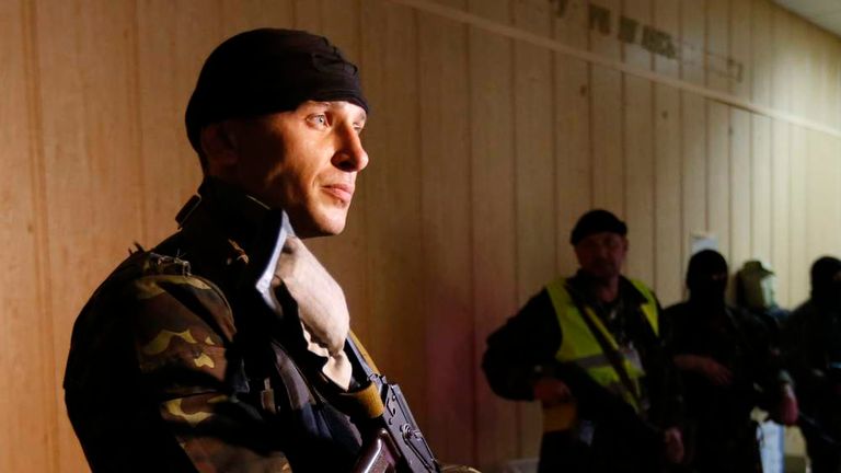 Pro-Russian armed men stand in the seized regional prosecutor's office in Luhansk
