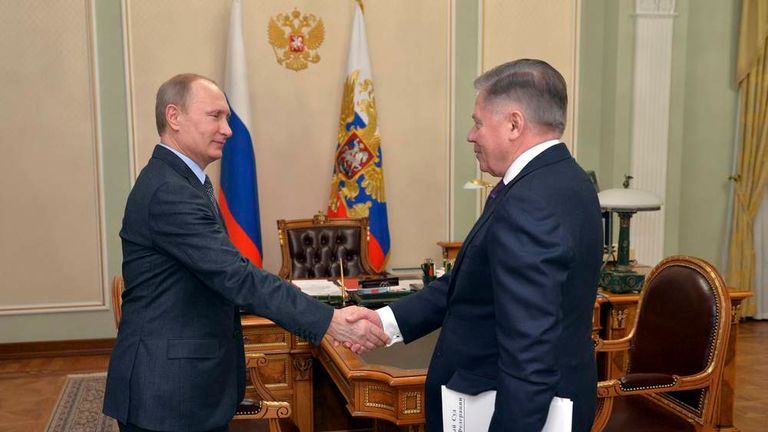 Russian President Putin shakes hands with Supreme Court chairman Lebedev during their meeting at the Novo-Ogaryovo state residence