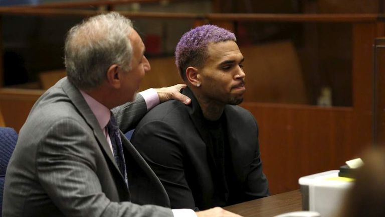 Singer Brown appears in court with his lawyer Mark Geragos for a progress hearing in Los Angeles, California