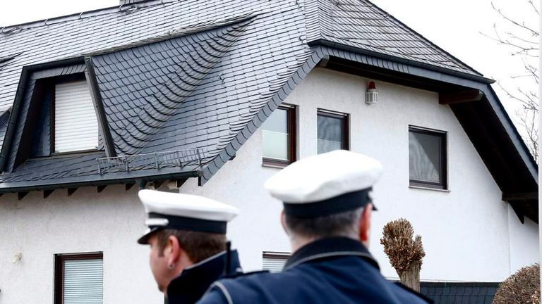 German policemen stand outside a house believed to belong to crashed Germanwings flight 4U 9524 co-pilot Lubitz in Montabaur