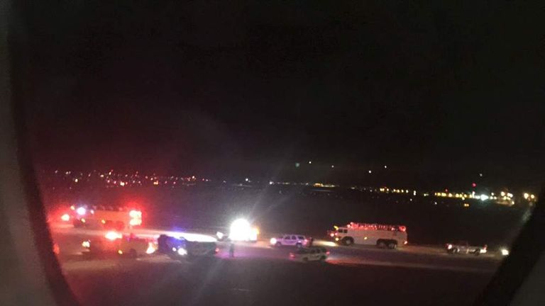 Emergency personnel are shown on the tarmac at Salt Lake City International Airport in this photograph taken by passenger Keith Rosso from a seat inside Air France flight 65
