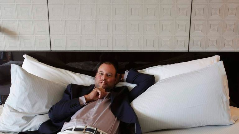 Ashley Madison founder Noel Biderman poses during an interview in Hong Kong