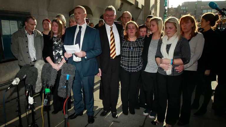 The family of Lee Rigby, stand as a police spokesman reads a statement on their behalf outside the Old Bailey