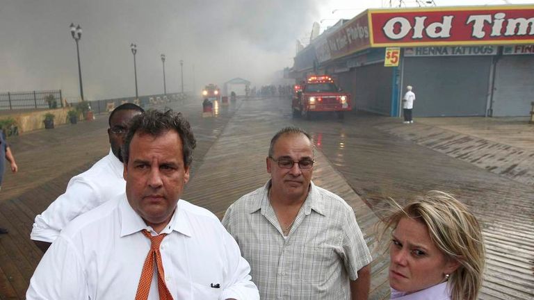 New Jersey Governor Chris Christie tours the fire area with his Deputy Chief of Staff Bridget Anne Kelly at the boardwalk in Seaside Heights