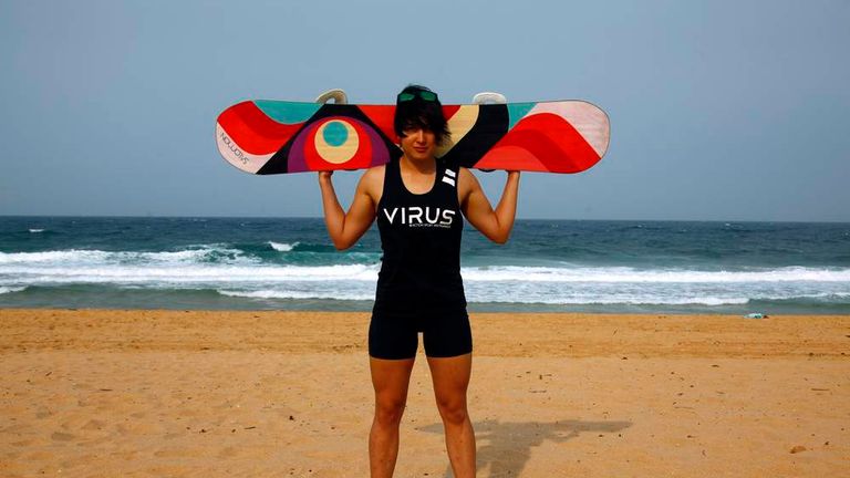 Australian snowboarder Belle Brockhoff poses with her snowboard on Collaroy Beach, in the northern beaches area of Sydney