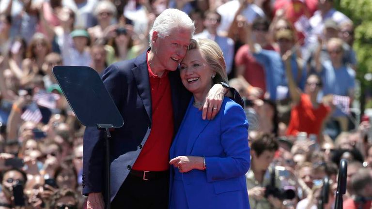 Hillary Clinton is embraced by her husband Bill Clinton