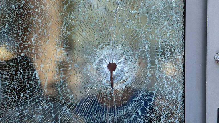 A broken glass window of the Imperiale Marhaba hotel is seen after a gunman opened fire at the beachside hotel in Sousse, Tunisia