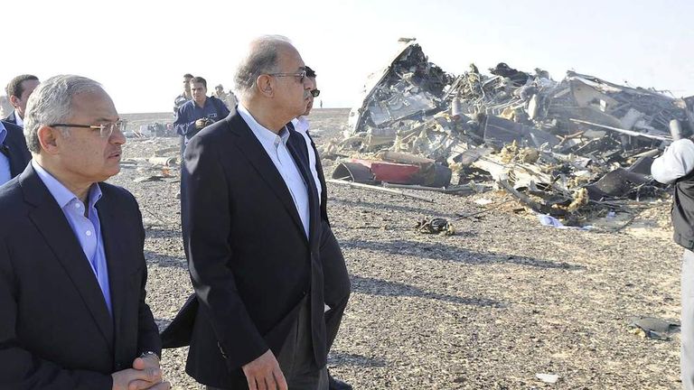 Egypt's Prime Minister Sherif Ismail (2nd L) and Tourism Minister Hisham Zaazou look at the remains of a Russian airliner which crashed in central Sinai near El Arish city