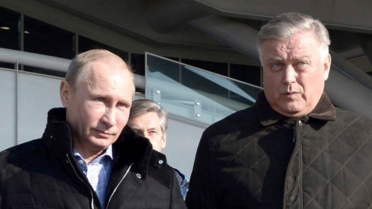 Vladimir Putin walks with Vladimir Yakunin during his visit to a recently constructed train station in Sochi